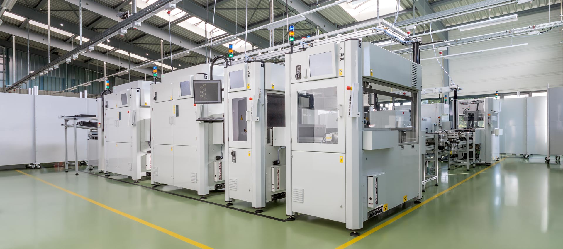 Semi-automatic assembly line for sensor units with in-line casting. The following processes are integrated: Caulking, laser soldering, casting, laser welding, leak testing. Cycle time < 12 seconds.